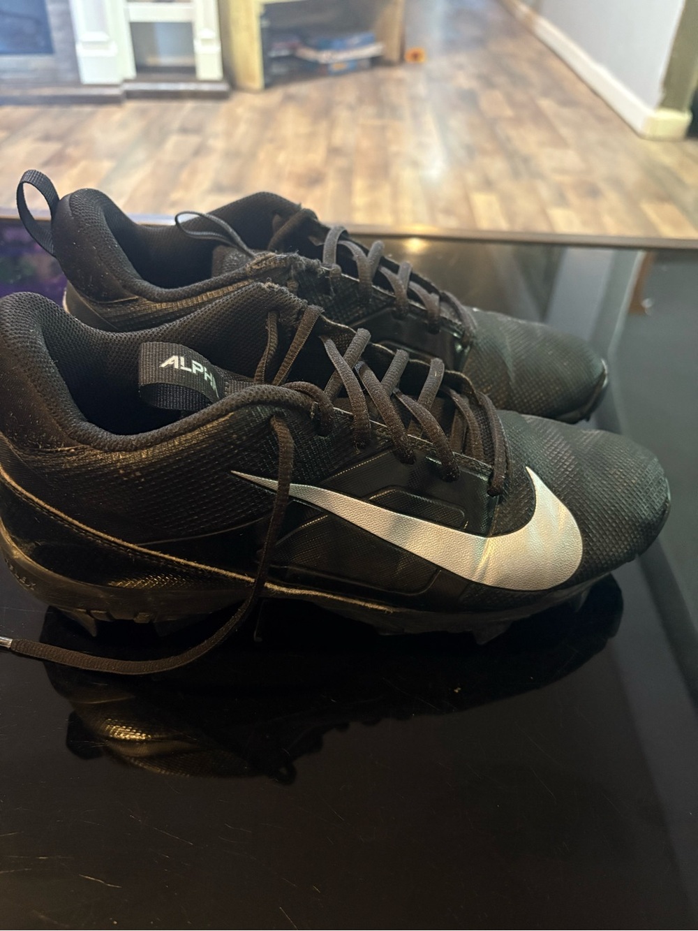 Nike Black Athletic Cleats with Silver Swoosh